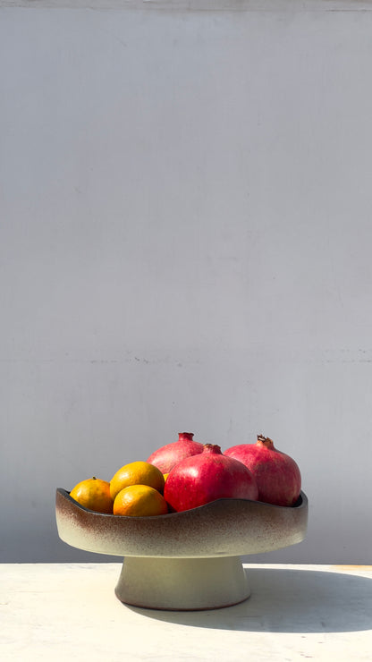 Earthy cake and fruits plate